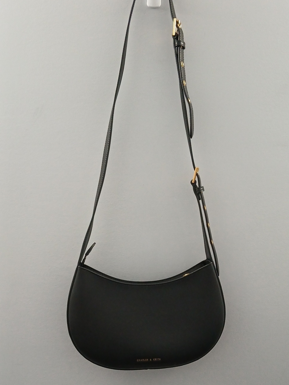 Charles & Keith Black Crescent Shoulder Bag with Gold Hardware